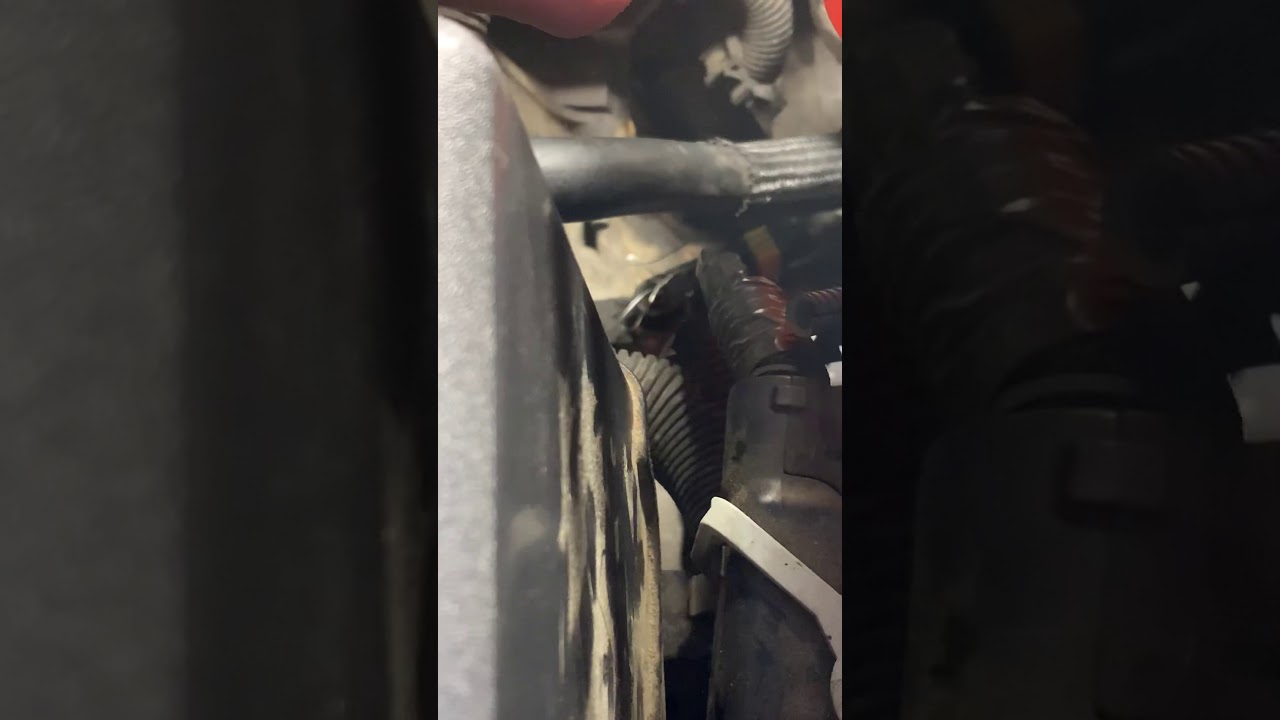 Mother fixing daughters car
