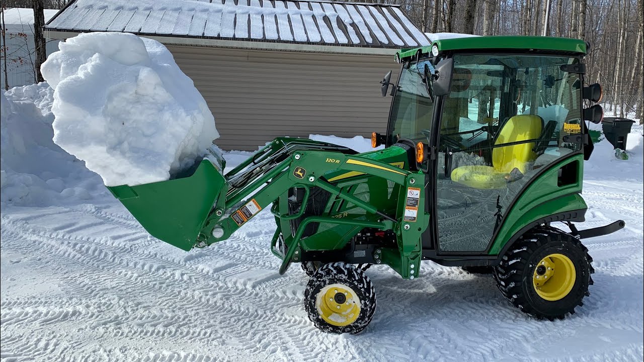 Cleaning up the yard with the John Deere 1025R YouTube