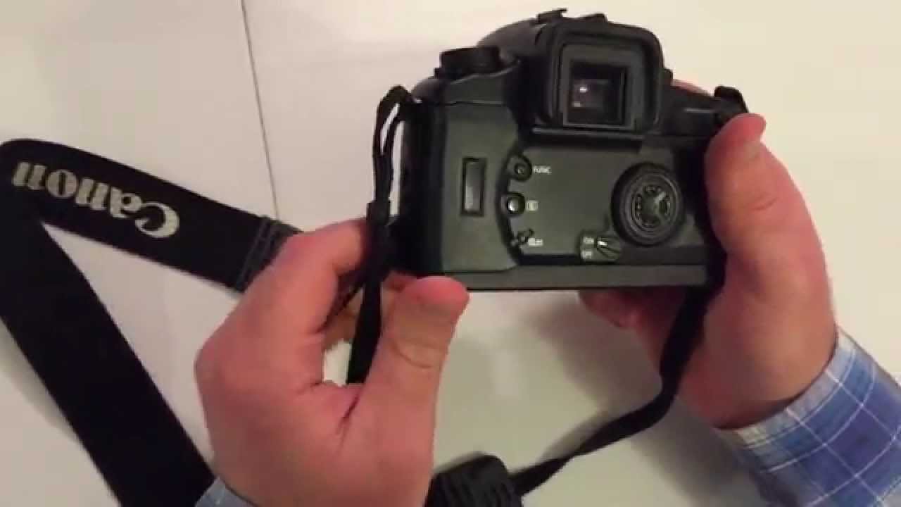 Canon EOS ELAN with lens, strap, and battery