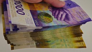 Counting Swiss Francs Guess How Much?