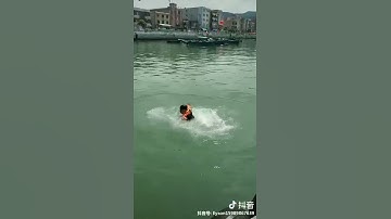 Testing Automatic inflatable life vest in a small pool.