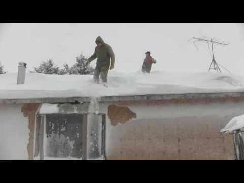 Jumping off house into snow.m4v