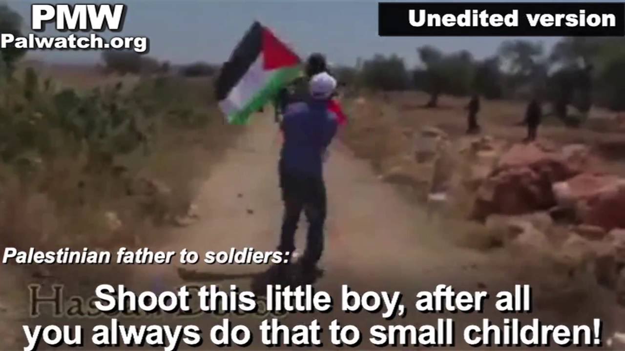 Palestinian father pushes son at Israeli soldiers, daring them to shoot. Soldier and boy shake hands