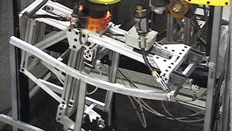 Multiple Robotic Cells with Dual Welding Robots and Material Handling Robot