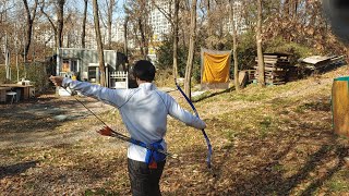 Dynamic Archery running shot/ hitting a golf ball in the air