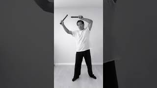 Nunchaku Training Exercise - High guard with downward strike