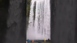 Iceland's waterfalls are insane! Look how small the people are.
