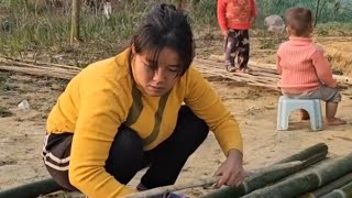 A single mother does the laundry and cooking for the household.