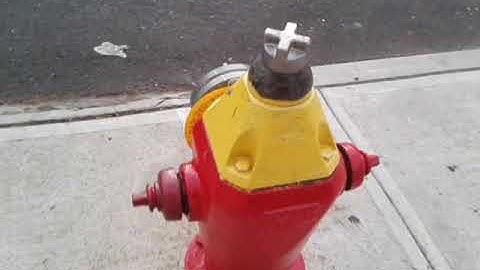 ROBOT FIRE HYDRANT THIS IS A FIRE HYDRANT THAT LOOKS LIKE A ROBOT RED AND YELLOW
