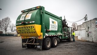 Mcneilus M/A Garbage Truck Collecting Alleyways