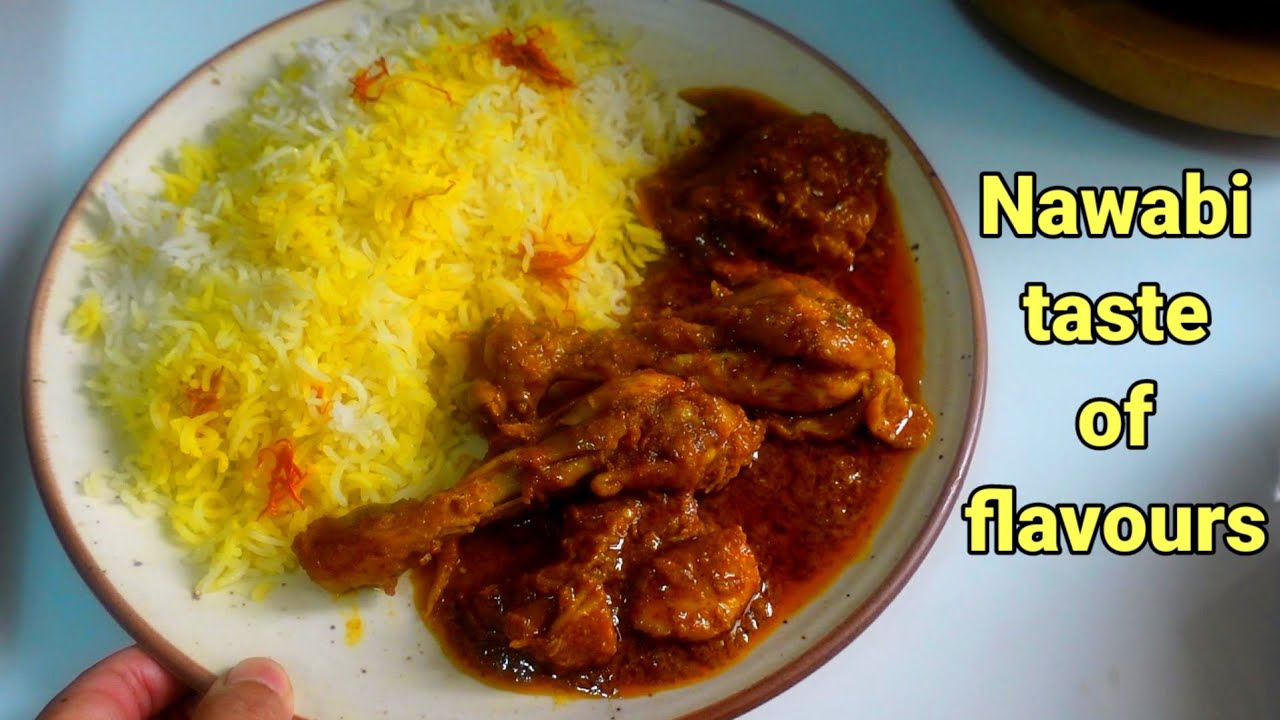 Very tempting plate of saffron rice & delicious chicken gravy with