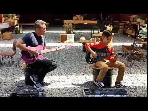 guitar-prodigy-kid-destroys-his-adult-duet-jamming-solo