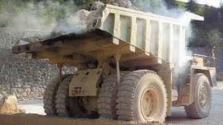 Big trucks carrying stones to the stone crusher plant