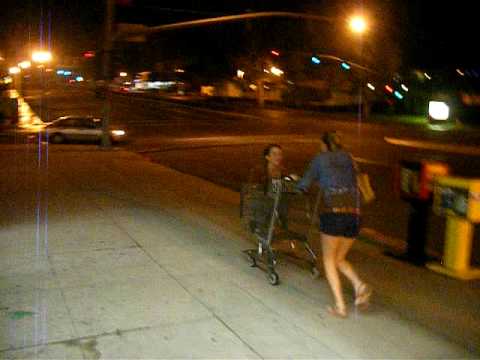 Emily and Andrea find a shopping cart.