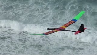 Light wind sloping in the mist above some big ocean swells.