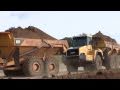 Volvo A30E And Komatsu HM350 Dumping Dirt