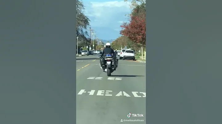 Motorcycle cop riding bike