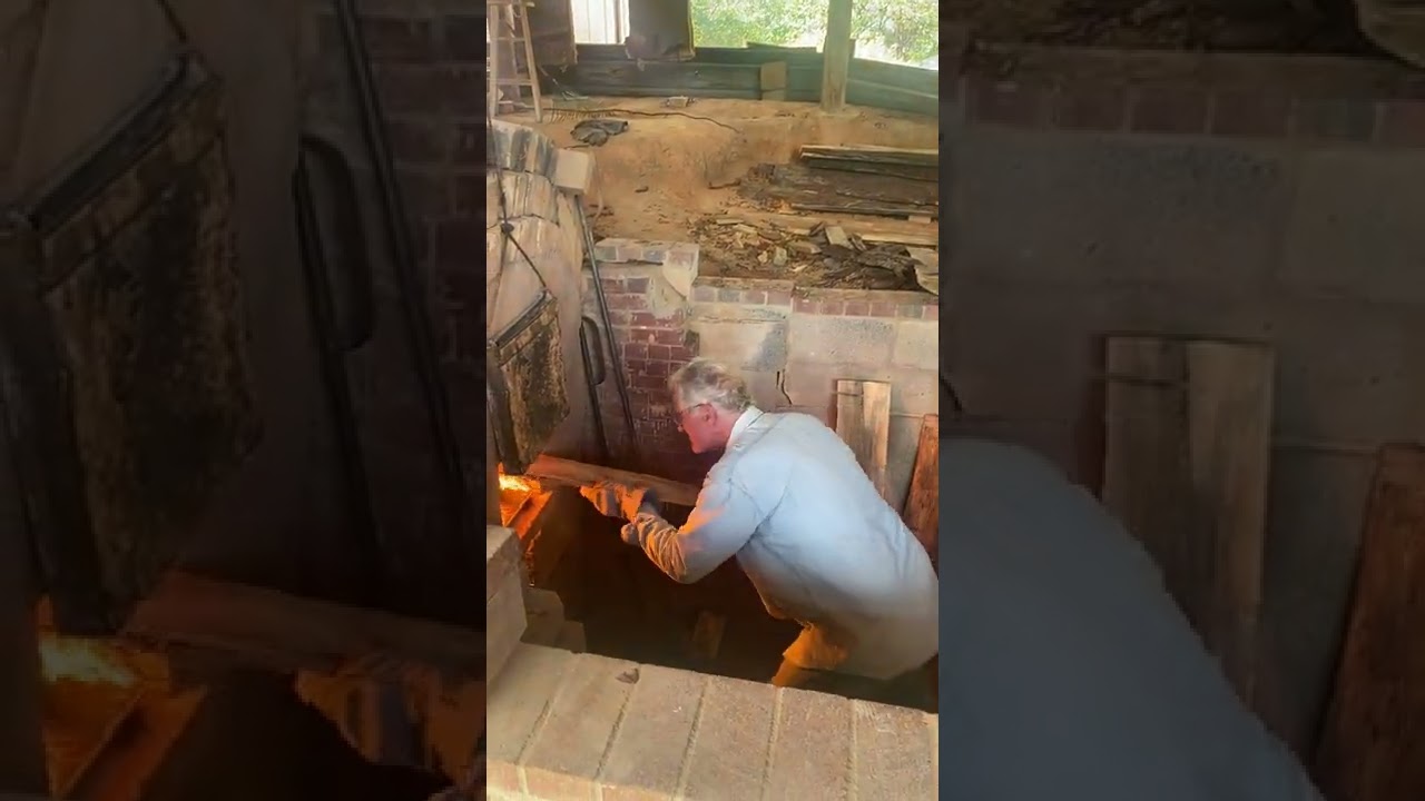 Mark stoking the kiln - Firing 108