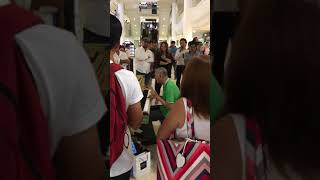 Old Man playing piano at a mall