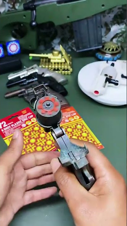 Mainan pistol dompis