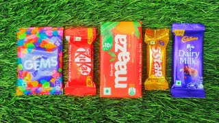 Colorful Chocolate Lineup on Fresh Green Grass🍫Sweet Treats That Brighten Your Day.🍫