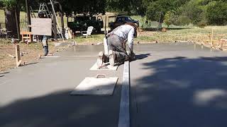 Veterans concrete,...begin cut control joints / finishing