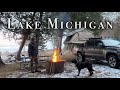 Winter rooftop tent camping on lake michigan