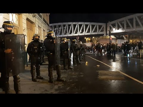 Protesters gather outside Paris theater where Macron attended play | AFP