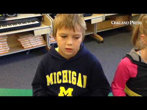 Kids taking part in a music class using iPads at  Webber Elementary School in Orion Township.