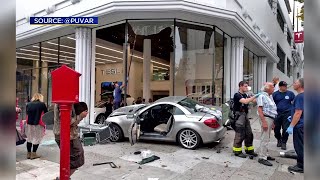 A car crashed into the tesla store at van ness ave. and o'farrell st.
in san francisco. emily turner reports. (9-4-17)