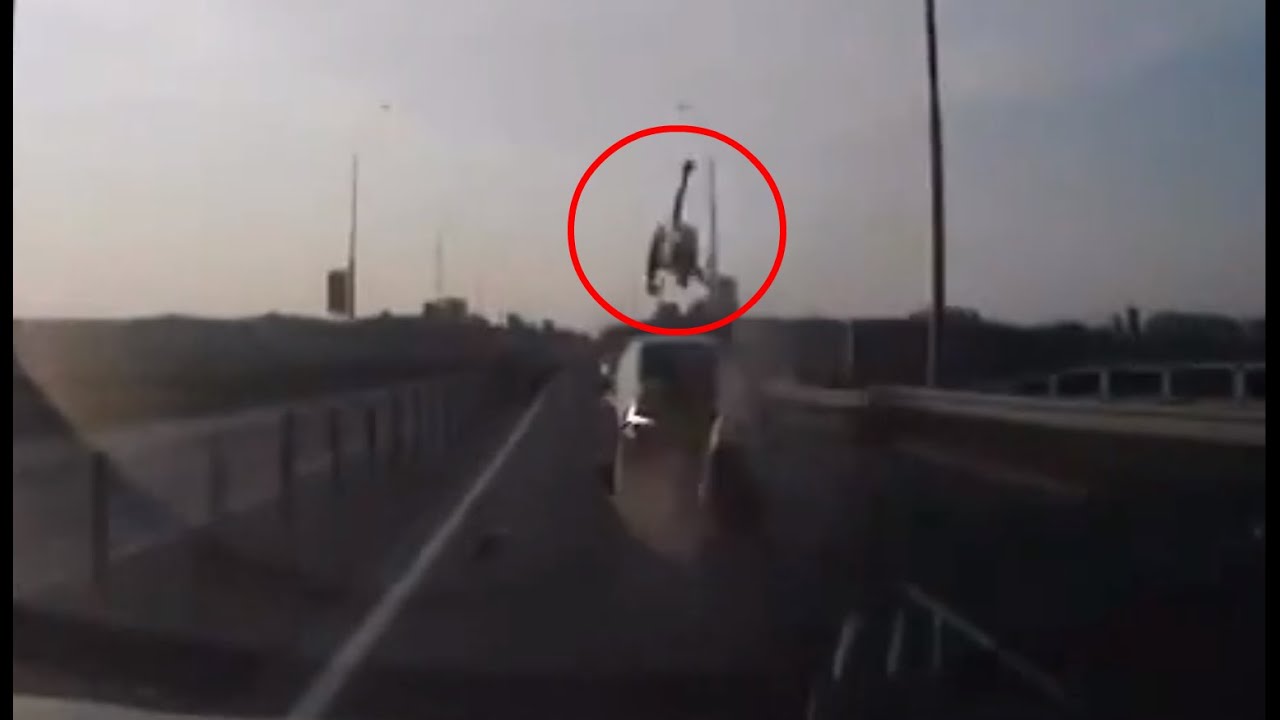 INSANE Motorcyclist Crashes and Lands Perfectly on Car Roof YouTube