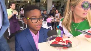 Osi Umenyiora enjoys the full Wimbledon experience with strawberries and cream