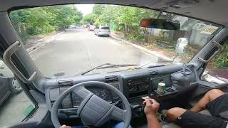 Aluminum Van Fuso Canter Pov driving inside city narrow and tight road.