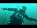 Female Diver is Diving with Neoprene Drysuit