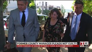 Former county manager pleads not guilty