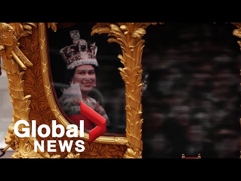 Hologram of young Queen waves from Gold State Coach during Jubilee pageant