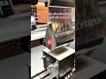 A press brake with custom tooling bends a sheet of metal with a smiley face drawn on it #engineering