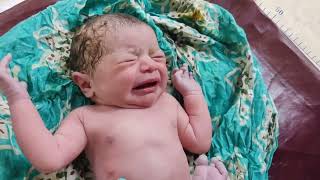 Gorgeous Newborn baby just after birth with first Cry is mesmerising