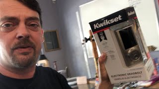 checking out the cheapest Kwikset electronic lock sold