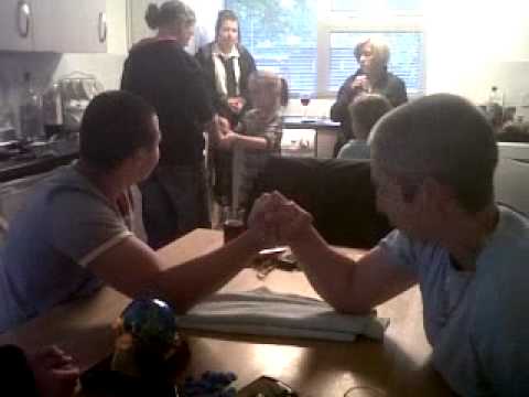 woman vs man in arm wrestle