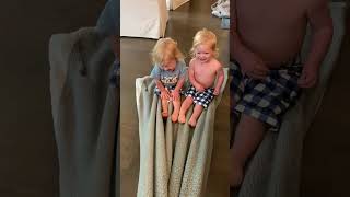 Precious Twins Enjoy Ride on Dragged Blanket