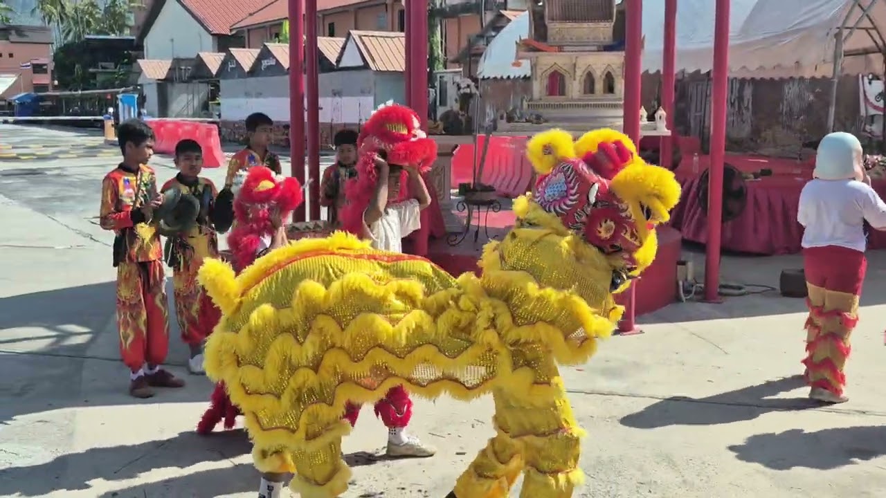 Children in Phuket, Thailand performing a traditional dance during Chinese New Year