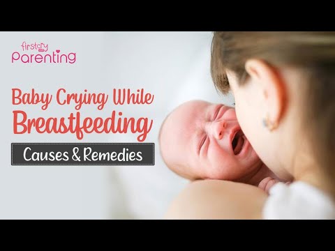 Video: The Baby Cries While Feeding - What To Do