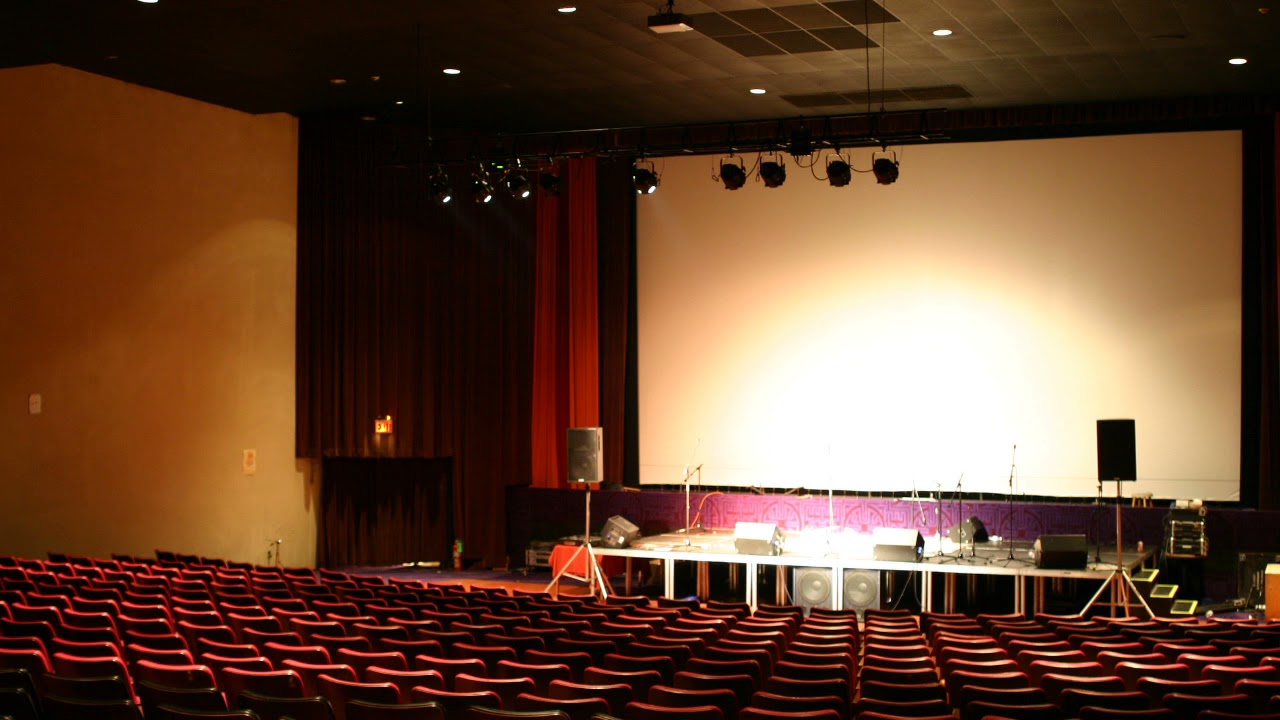 Beat It by Michael Jackson playing in a empty auditorium