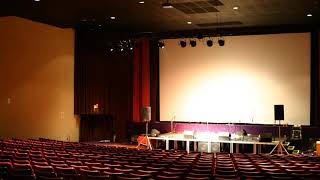 Beat It by Michael Jackson playing in a empty auditorium