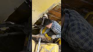 Excavator boom seat bushing rework to restore original vehicle appearance