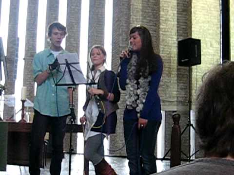 Love shine a light van het Zandvliet orkest en koor