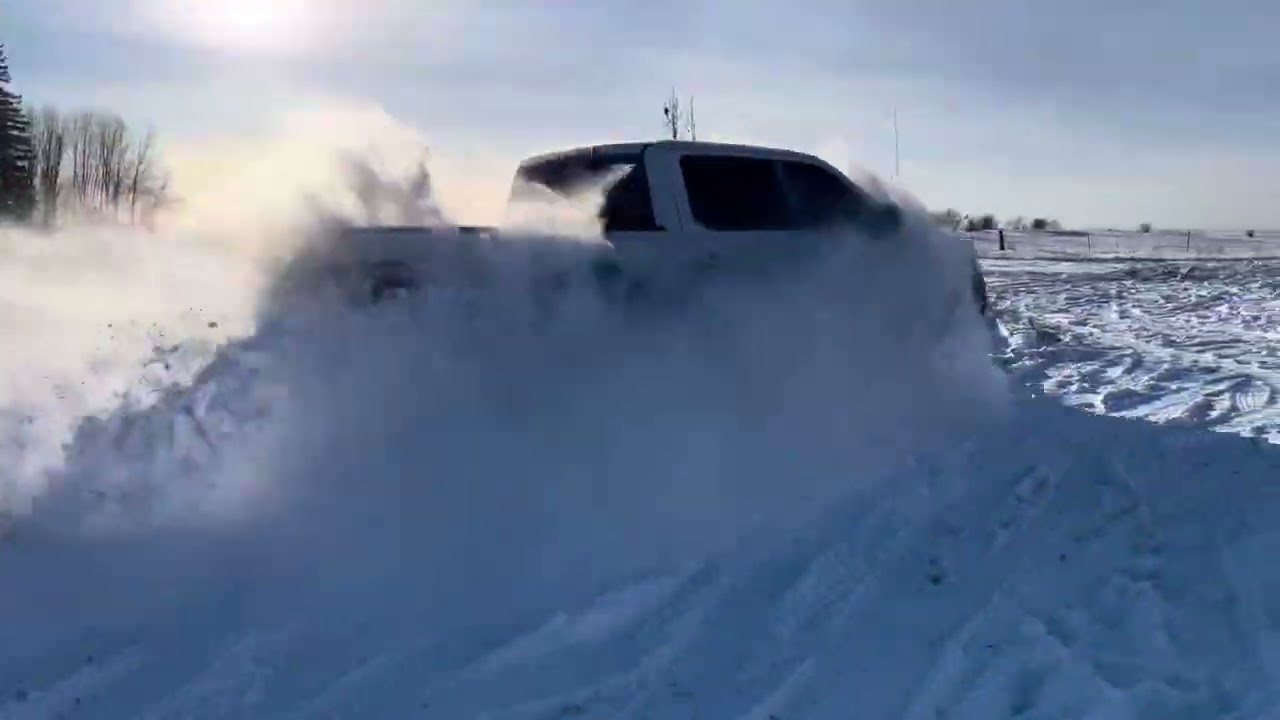 Snow Bogging in the Silverado and Raptor as well as Refrigerator/Bed liner Surfing