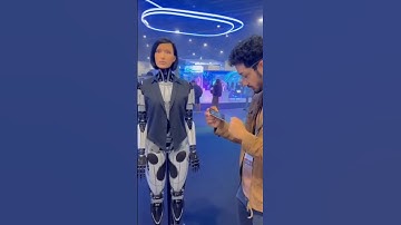 Man tests a robot at a high-tech exposition! #robot #humanoid