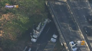 Tractor trailer hits overpass in Queens, roof sheared off